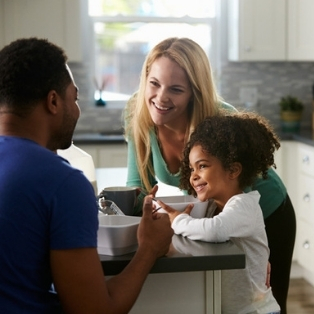 family at kitchen island