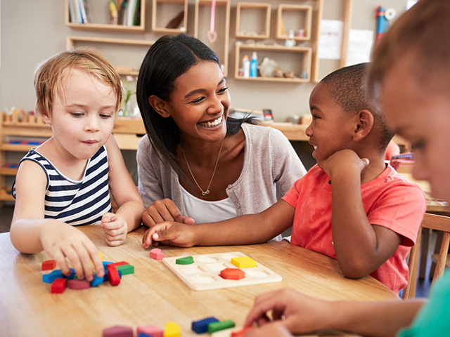 Educator playing with children