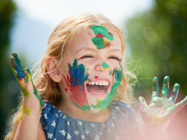 Smiling young girl with facepaint.