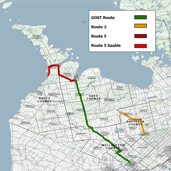 Route Map for Interim Recommendation Phase. Map shows Bruce County and surrounding counties with coloured transit routes. The GOST Route is shown in green, Route 2 in yellow, Route 5 in dark red, and Route 5 Sauble in bright red, connecting communities across Bruce, Grey, Wellington, and Dufferin counties.