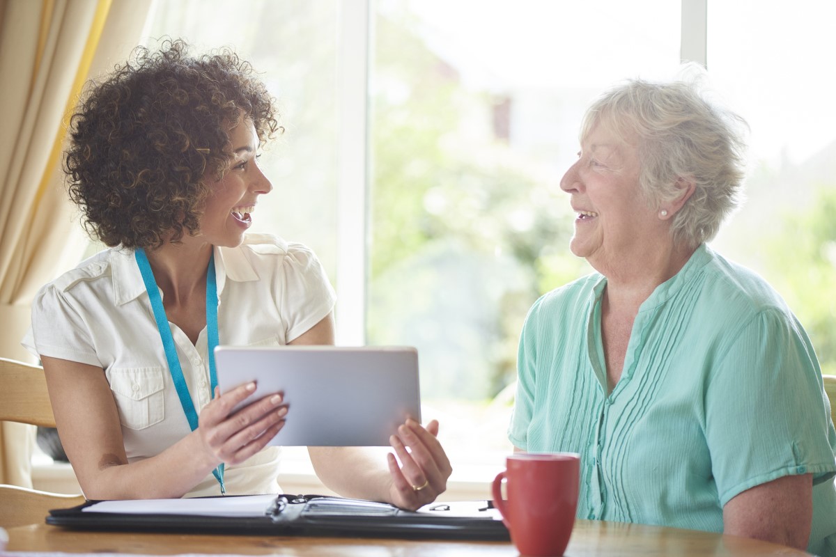 nurse discussing information with patient