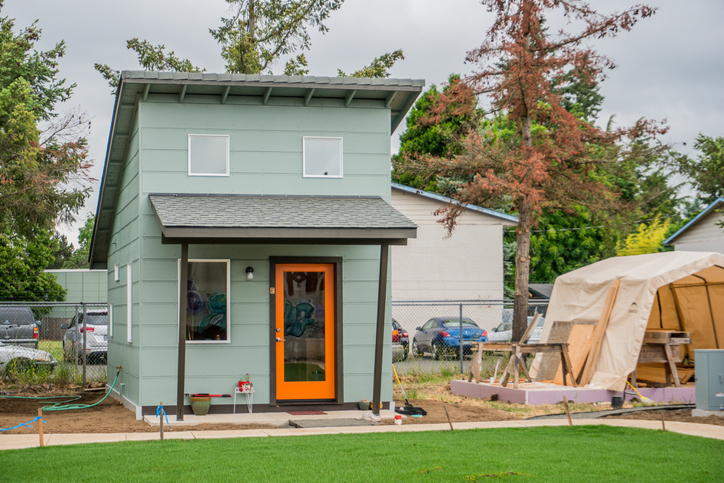 photo of an additional residential unit beside a garage shelter