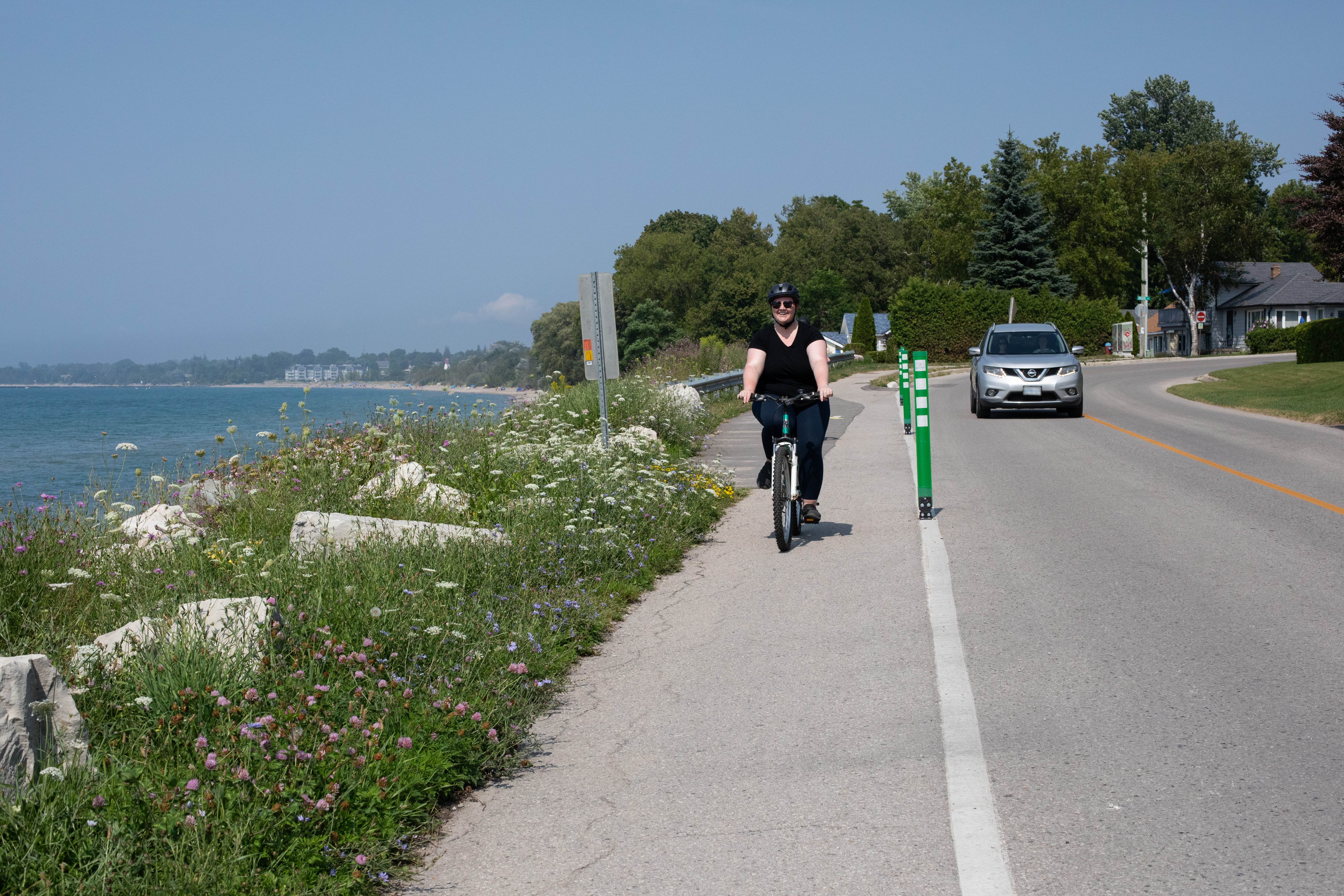 Women riding bicycle along the coast