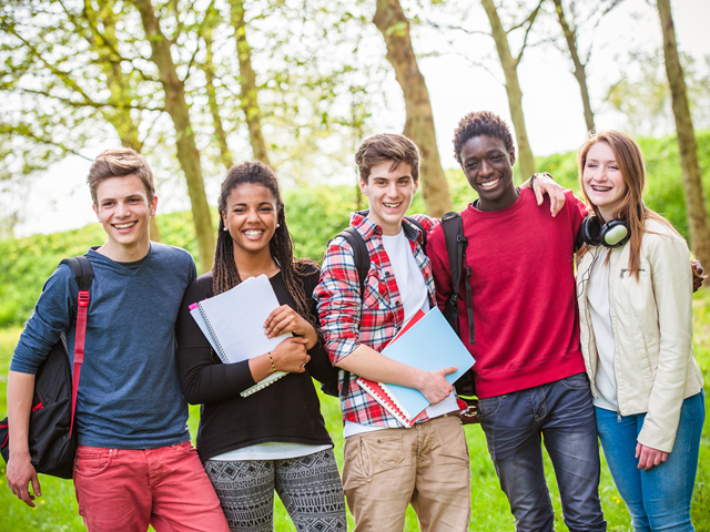 students standing in a forest