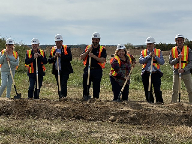 A group of dignitaries stand with shovels for a ceremonial ground turning at the site of the Eastridge Road Community Housing development in Walkerton. From left: Kym Hutcheon, deputy mayor, Municipality of Brockton; John Peevers, senior advisor, corporate affairs, Bruce Power; Don Murray, deputy warden, Bruce County; Luke Charbonneau, warden, Bruce County; the Honourable Lisa Thompson, M.P.P and minister of rural affairs; Chris Peabody, councillor, Bruce County; and Gregory J. McLean, councillor, Municipal