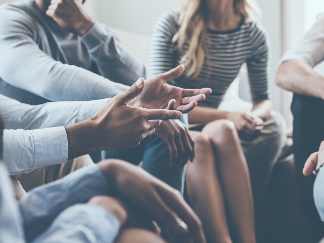 a group of people having a discussion