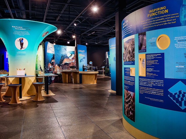 The Inspiring Nature, Inspired Techno exhibit space with multiple displays.