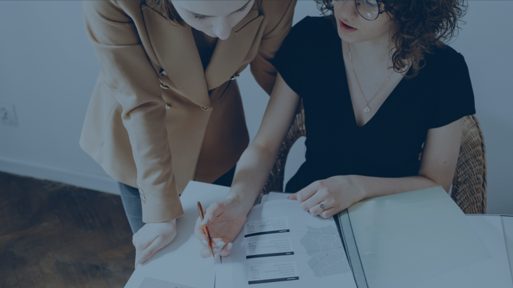 Two people looking at paperwork