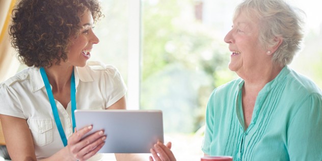 two_people_looking_at_a_tablet_description